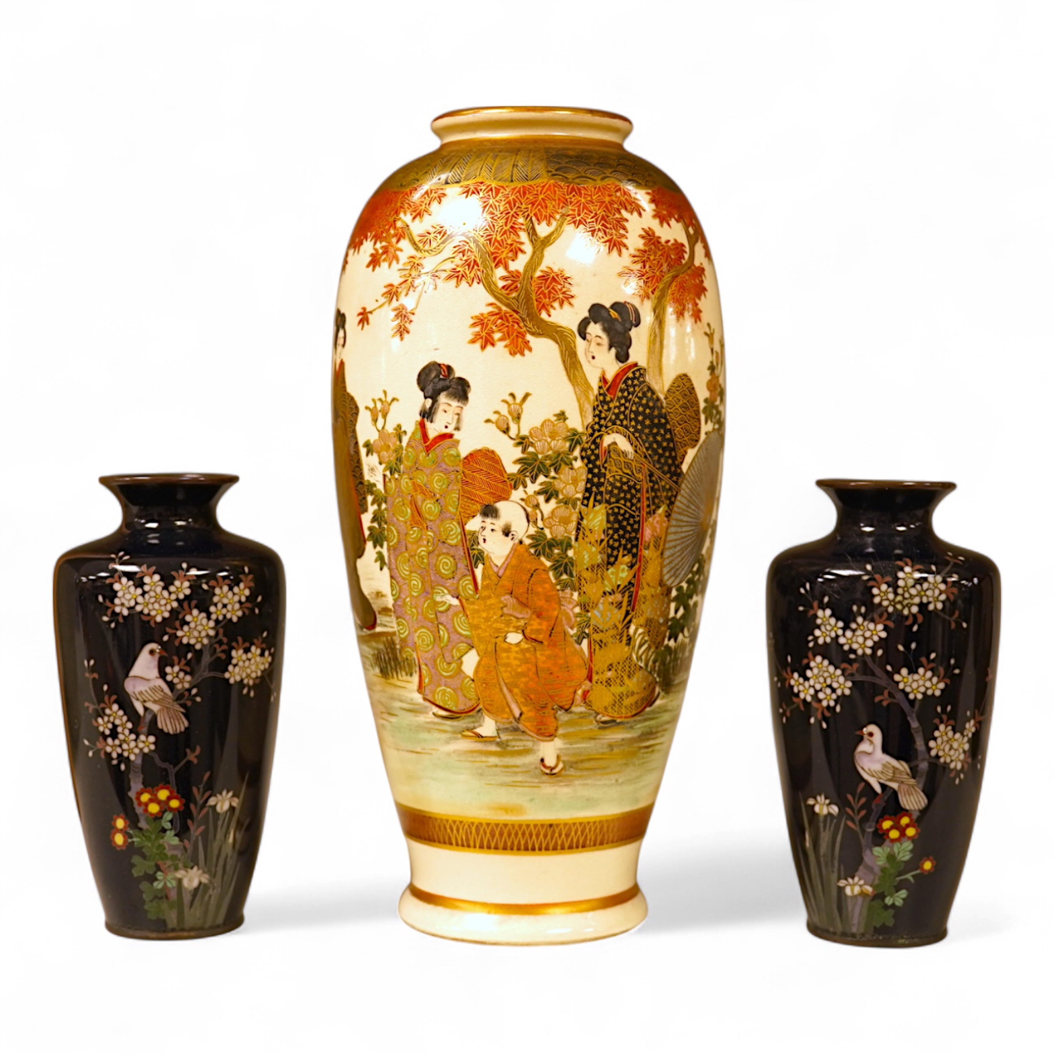 A Japanese figural satsuma vase and a pair of small black cloisonné enamel vases, Satsuma 21.5cm high